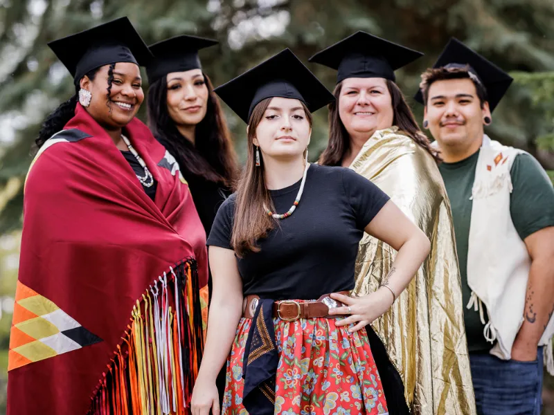 SKC students in graduation attire.