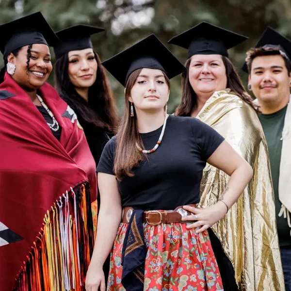 SarahGrads-Gallery-1 SKC students in graduation attire.